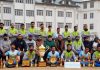 Winning Football team posing for a group photograph with trophy at Srinagar.