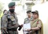 Lt Professor Savita Jamwal receiving ADG Medal and mementos from Maj General NK Arrey at Jammu.