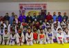 DG YSS, Saleem-Ur-Rehman posing for a group photograph with Taekwondo players at Khel Gaon Nagrota on Tuesday.