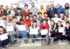 Medal winners of Weightlifting Championship posing for a group photograph with chief guest at Jammu on Friday.