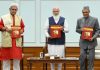 Prime Minister Narendra Modi releases 11 volumes of manuscript with commentaries by 21 scholars on shlokas of Srimad Bhagavad Gita in New Delhi. on Tuesday. Lt Governor Manoj Sinha and senior Congress leader Karan Singh are also seen.
