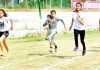 Young female athletes in action during track event at Jammu University Ground Jammu on Saturday.
