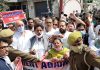 Cong activists taking out protest march in Jammu West on Saturday.