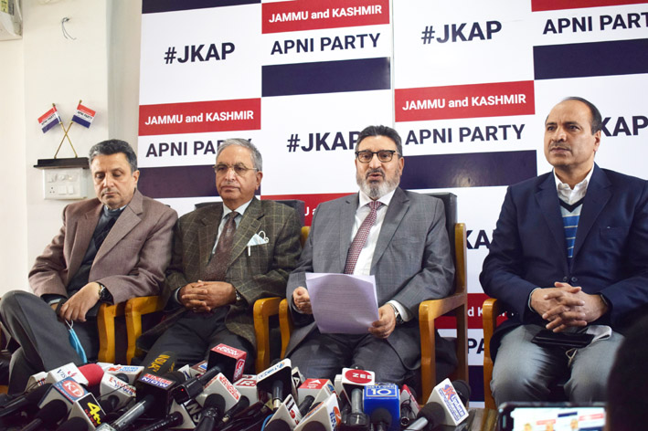 JKAP president, Altaf Bukhari, flanked by others addressing press conference in Srinagar.
