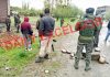 Troops at the site of IED recovery along circular road in Pulwama on Friday. —Excelsior/Younis Khaliq