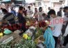People purchasing vegetables in Sabzi Mandi at Parade Ground Jammu during morning hours on Monday. —Excelsior/Rakesh