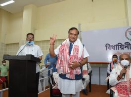 Himanta Biswa Sarma displaying victory sign after being elected as the Legislative Party leader. (UNI)