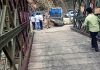 Traffic blocked as a portion of approach road to Asso Bridge sinks in Bani area on Monday.— Excelsior/Pardeep