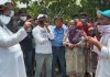 Cong leader Raman Bhalla joining Safaikaramcharis protest at Kunjwani on Monday.