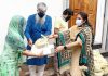 Senior BJP leader Priya Sethi distributing free ration among the poor and needy people.