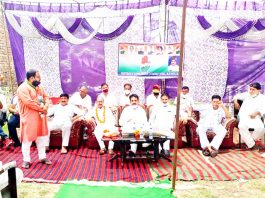 DDC president, Dr Manohar Lal Sharma addressing public meeting in Kathua on Monday.