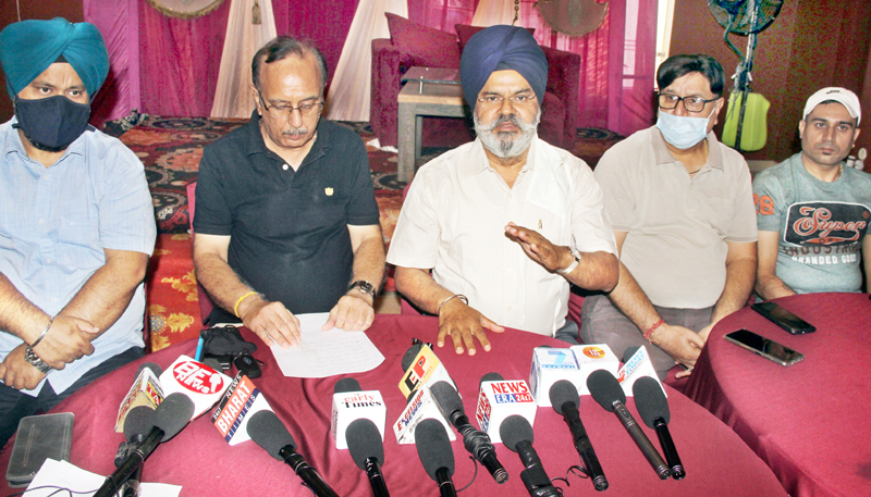 Erstwhile wine traders addressing a press conference at Jammu on Wednesday. -Excelsior/Rakesh