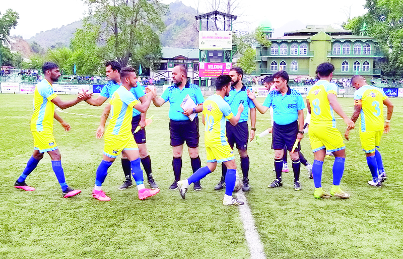 Players interacting with referees before start of the game at TRC Ground Srinagar on Thursday.