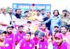 Winning team posing alongwith trophy and organisers of the tournament at Baramulla on Tuesday.