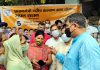 MP Jugal Kishore Sharma interacting with beneficiaries of Gareeb Kalyan Ann Yojna at Jammu on Sunday.