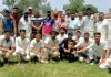 Players of Singh Cricket Club Akhnoor posing for group photograph in jubilant mood after winning Friendship Cup.
