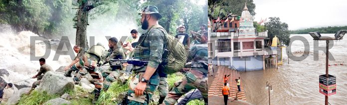 Army jawans assisting SDRF and police in rescue operation at village Honzar in Kishtwar (left) and a portion of temple submerged in flooded Chenab river at Akhnoor on Wednesday (right). -Excelsior pics by Tilak Raj & Rakesh