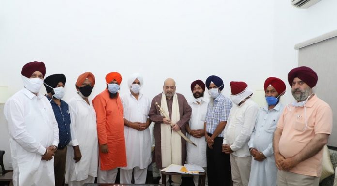Union Home Minister Amit Shah meeting a delegation from All Sikh Gurdwara Management Committee-Kashmir in New Delhi on Sunday.
