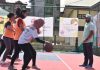 Players in action during Basketball match being played at Gindun Sports Center Srinagar on Tuesday.