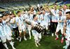 Argentina players celebrating victory with Messi holding winning trophy of Copa America on Sunday.
