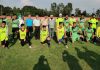 Players posing for a group photograph with dignitaries at Sports Stadium Kathua.