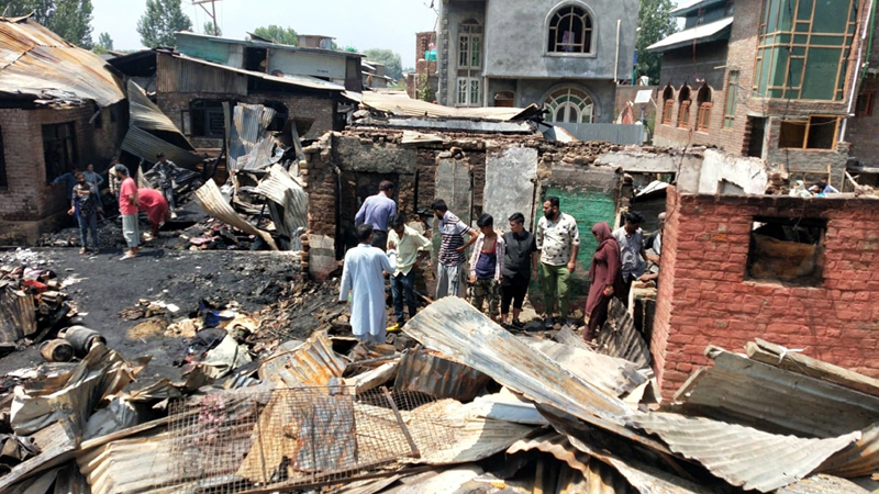 Aftermath of blaze at Noorbagh area of Srinagar on Tuesday. -Excelsior/Shakeel