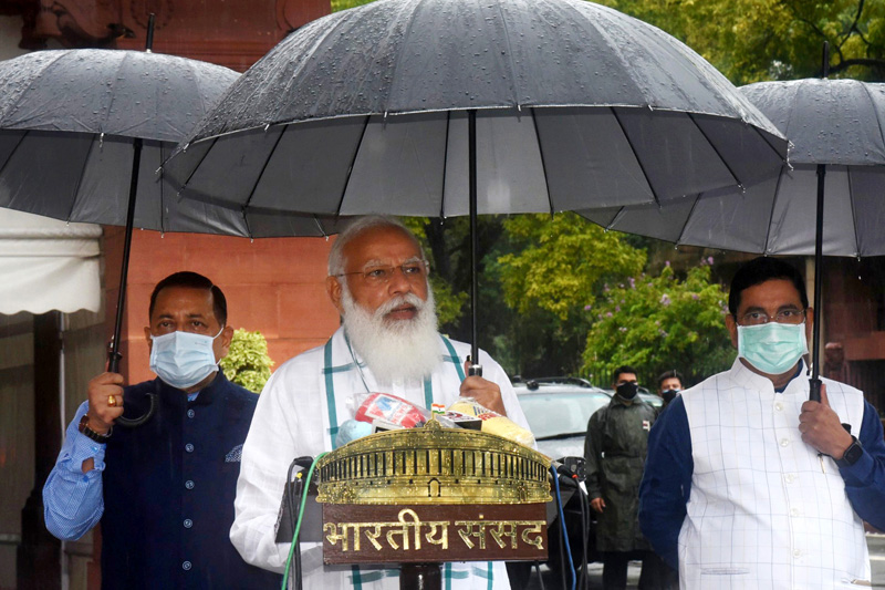 Prime Minister Narendra Modi addressing the media at Parliament House on the first day of the Monsoon Session on Monday. Also seen are Union Ministers Dr Jitendra Singh and Pralhad Joshi.