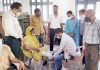 Doctors and patients during artificial limb fitment camp at Jammu.