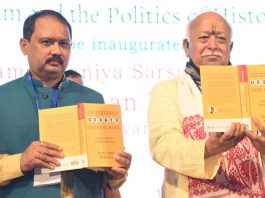 Rashtriya Swayamsevak Sangh (RSS) chief Mohan Bhagwat and author Dr Nani Gopal Mahanta launching the book 'Citizenship Debate Over NRC and CAA' in Guwahati on Wednesday. (UNI)