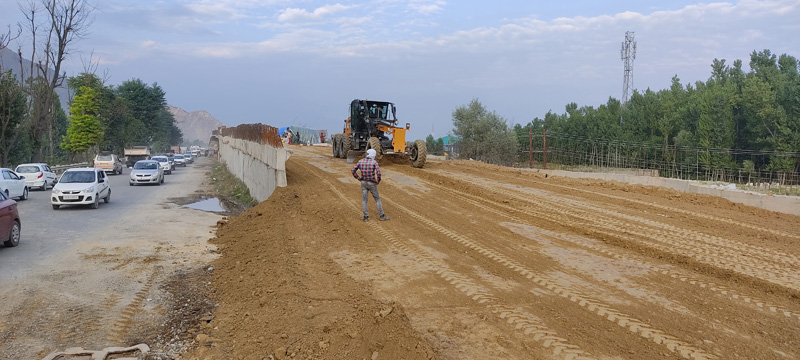 Construction work on Lasjan grade separator underway on the outskirts of Srinagar on Wednesday. - Excelsior/Shakeel