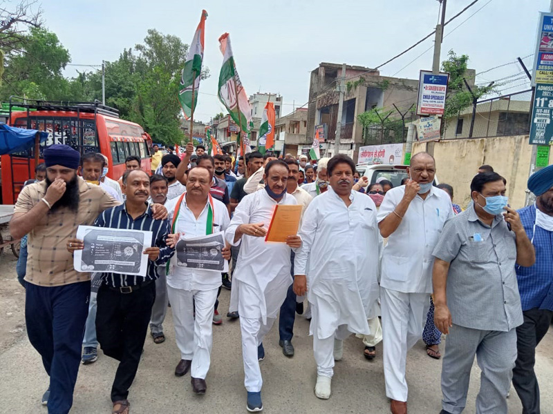 Cong leaders and workers taking out protest rally at Bishnah on Wednesday.