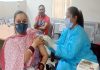 A woman getting vaccine dose during a camp at Passport Seva Kendra Jammu on Saturday.