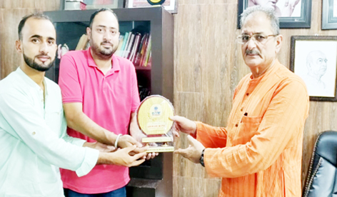 Former Deputy Chief Minister Kavinder Gupta being presented a memento by representatives of DITM College at Jammu on Tuesday.