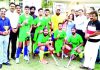 Winning Hockey team posing for a group photograph with dignitaries at Jammu on Monday.