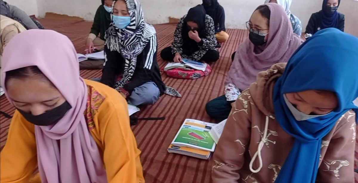 Girls students attending class as schools re-open in Kargil. -Excelsior/Basharat Ladakhi
