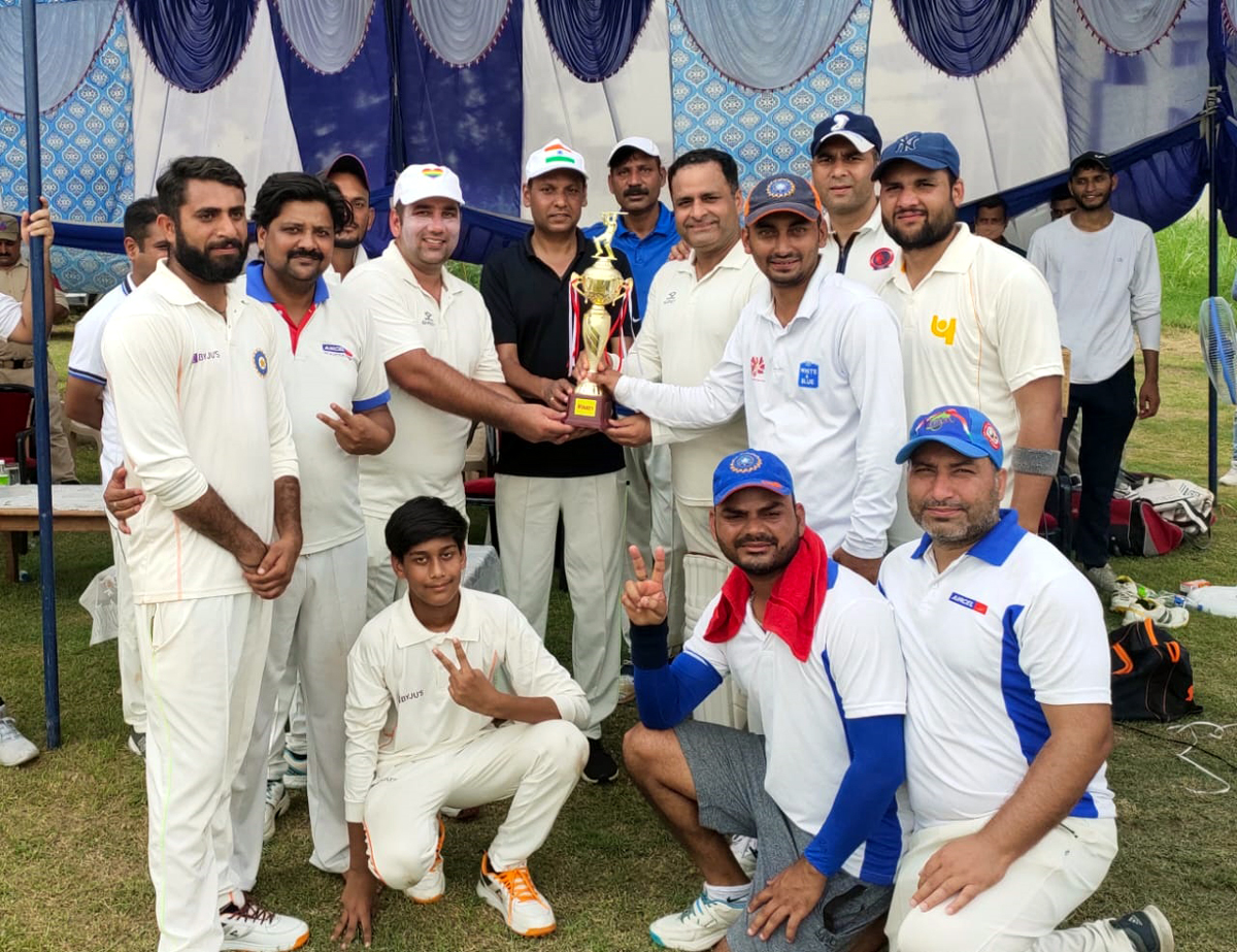 ADGP Jammu, Mukesh Singh presenting winning trophy to Media-XI players at KC Sports Ground Jammu on Sunday.