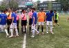 Players interacting with referees before the match at TRC Ground Srinagar on Friday.