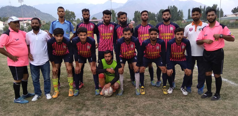Winning team posing for a group photograph after the match at Srinagar.