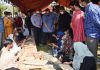 Union Minister Rajeev Chandrashekhar inspecting stalls installed by youth.