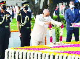 President Ram Nath Kovind paying floral tributes at Rajghat on the occasion of 152nd birth anniversary of Mahatma Gandhi, in New Delhi on Saturday. (UNI)