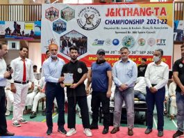 A player being awarded by dignitaries during the closing ceremony of J&K Thang-Ta championship at Srinagar.