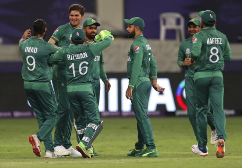 Pakistan players celebrating victory against India at Dubai on Sunday.