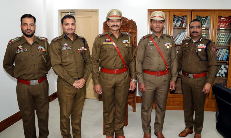 DGP Dilbag Singh and newly promoted officials posing for group photograph.