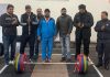 Officials of JKWA and coaches during the handing over ceremony of the Weightlifting set at MA Stadium Jammu.