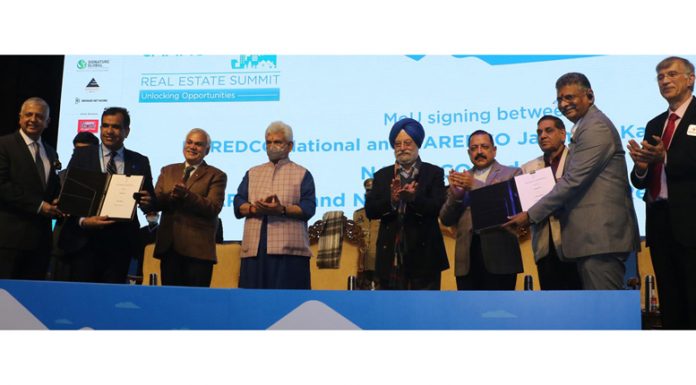 Union Ministers Hardeep Singh Puri and Dr Jitendra Singh, Lieutenant Governor Manoj Sinha and others at Real Estate summit in Jammu on Monday.