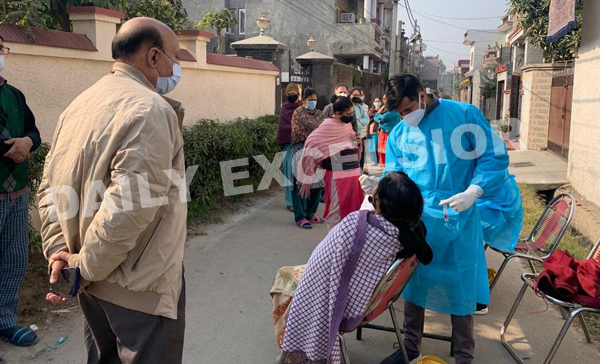 Health workers test people for COVID at Saraswati Vihar in Talab Tillo Jammu on Wednesday. The locality has been declared as micro-Containment Zone after detection of Omicron cases.