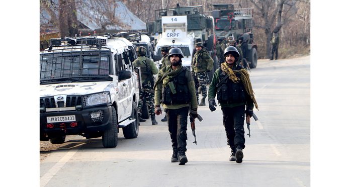Security personnel during an encounter at Chowgam in Shopian on Saturday. (UNI)
