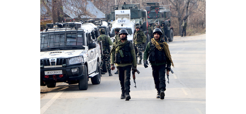 Security personnel during an encounter at Chowgam in Shopian on Saturday. (UNI)