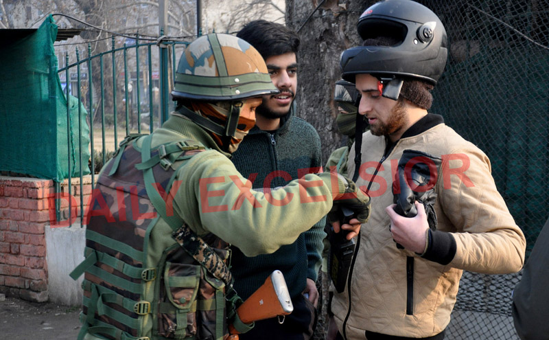 After Zewan attack, security beefed up in Srinagar with security forces carrying out random frisking in Lal Chowk on Tuesday. —Excelsior/Shakeel
