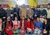 Winners of essay contest posing for a group photograph with JU Vice Chancellor Manoj Dhar and others at Roop Nagar Jammu.
